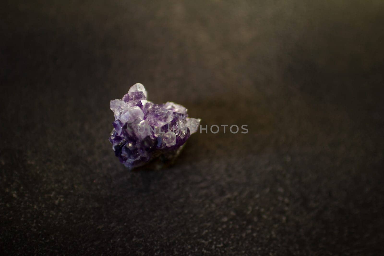 Violet amethyst quartz crystal on black background by VeronikaAngo