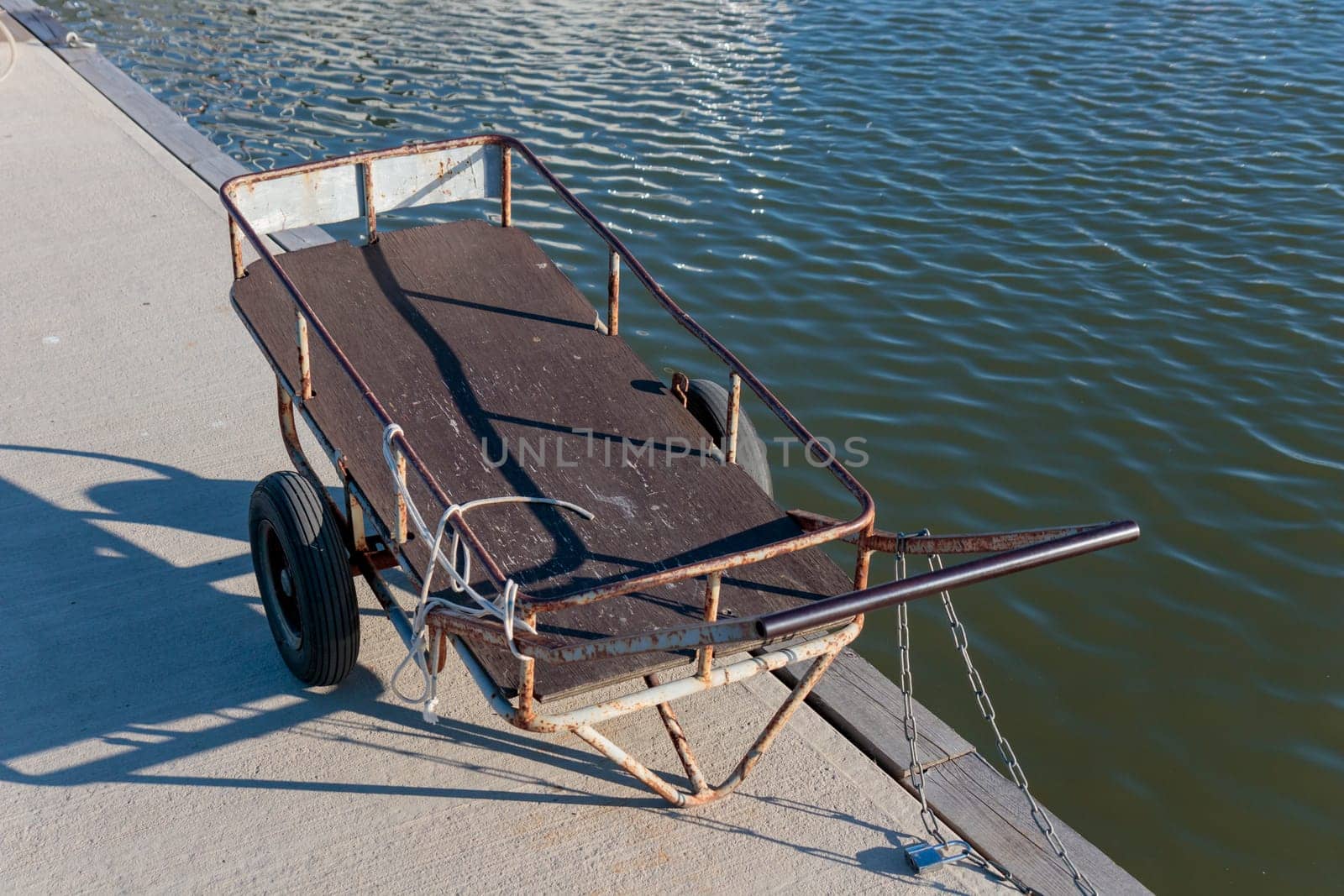 Trolley at the pier marina sea port for sailboats near the sea, harbor, sea and blue sky, sunny day, Finland