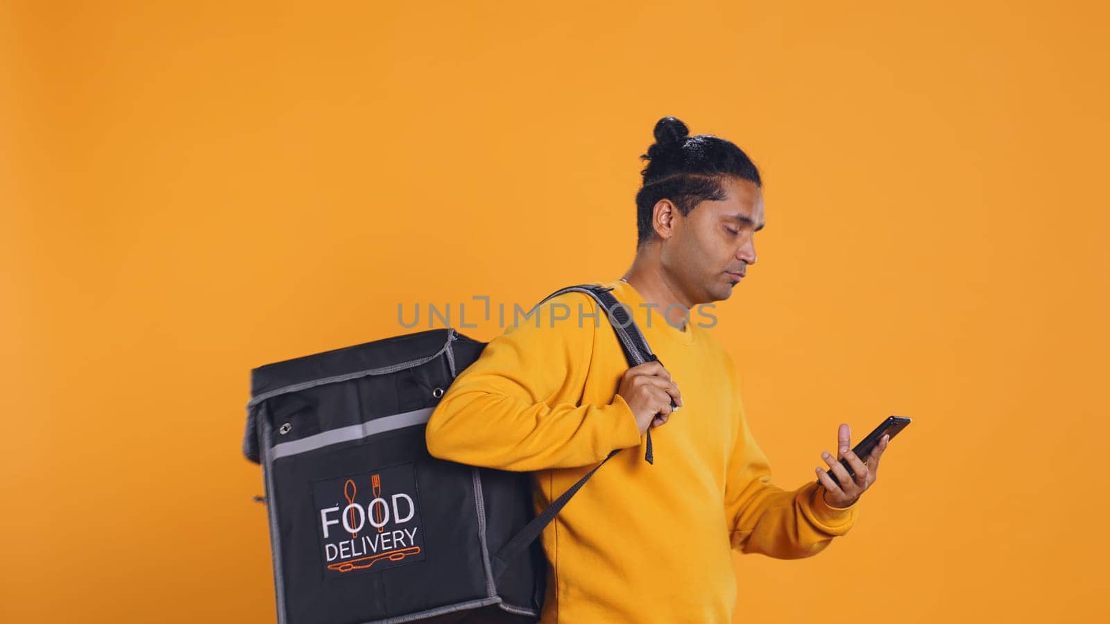 Man doing food delivery answering phone, fulfilling clients orders by DCStudio