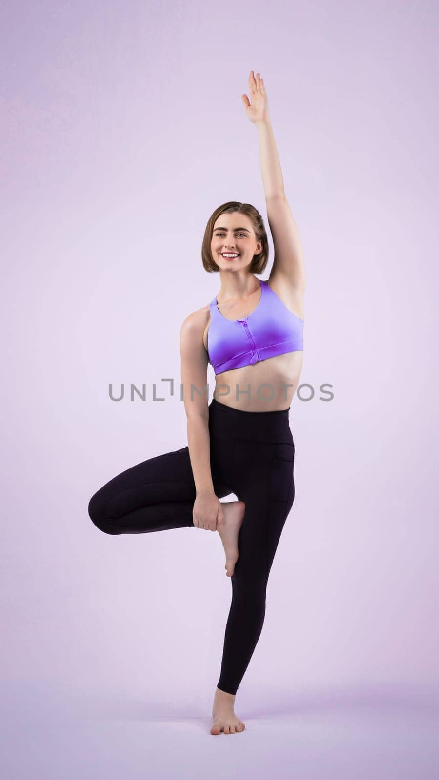 Full body length gaiety shot athletic and sporty woman doing yoga by biancoblue