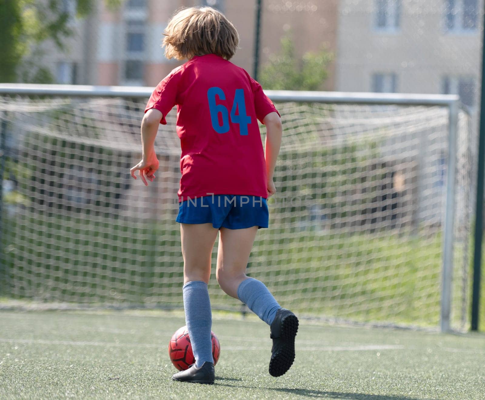 Girl Leads Ball From Behind In Soccer Practice
