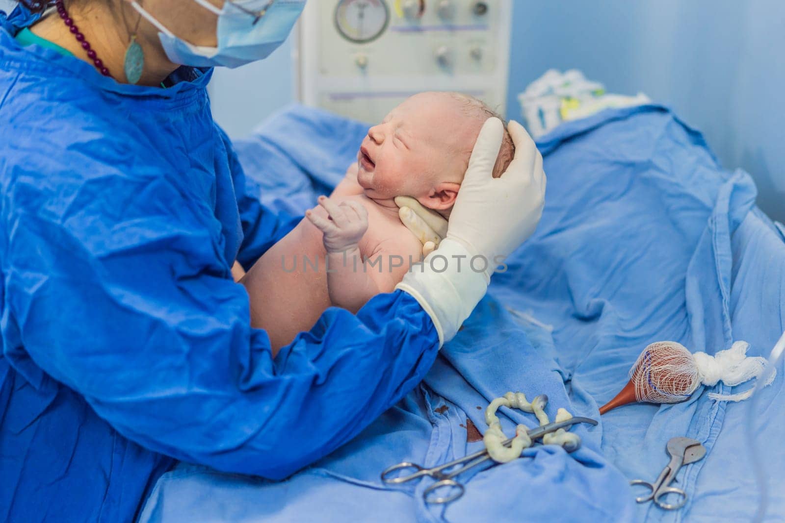 A nurse caring for a newborn baby in a hospital setting. The nurse provides gentle and attentive care, ensuring the baby's comfort and well-being.