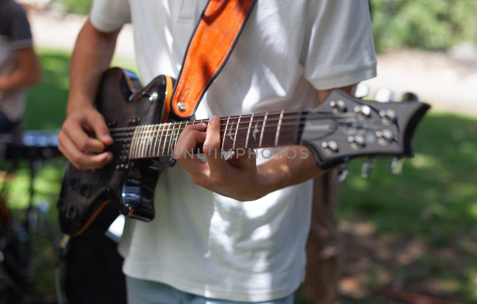 Boy plays country guitar. High quality photo