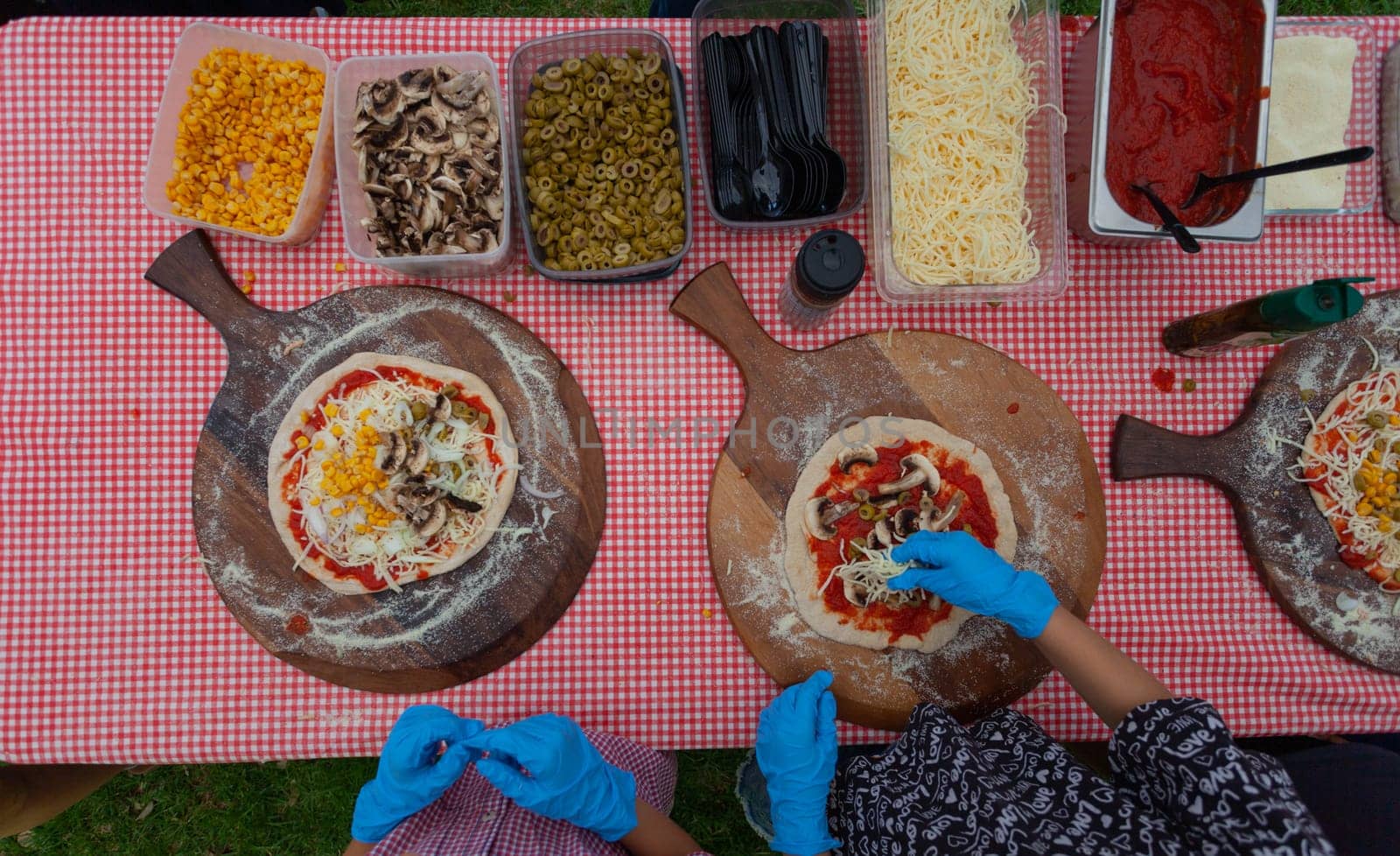 CHILDREN are preparing pizza. View from above. High quality photo