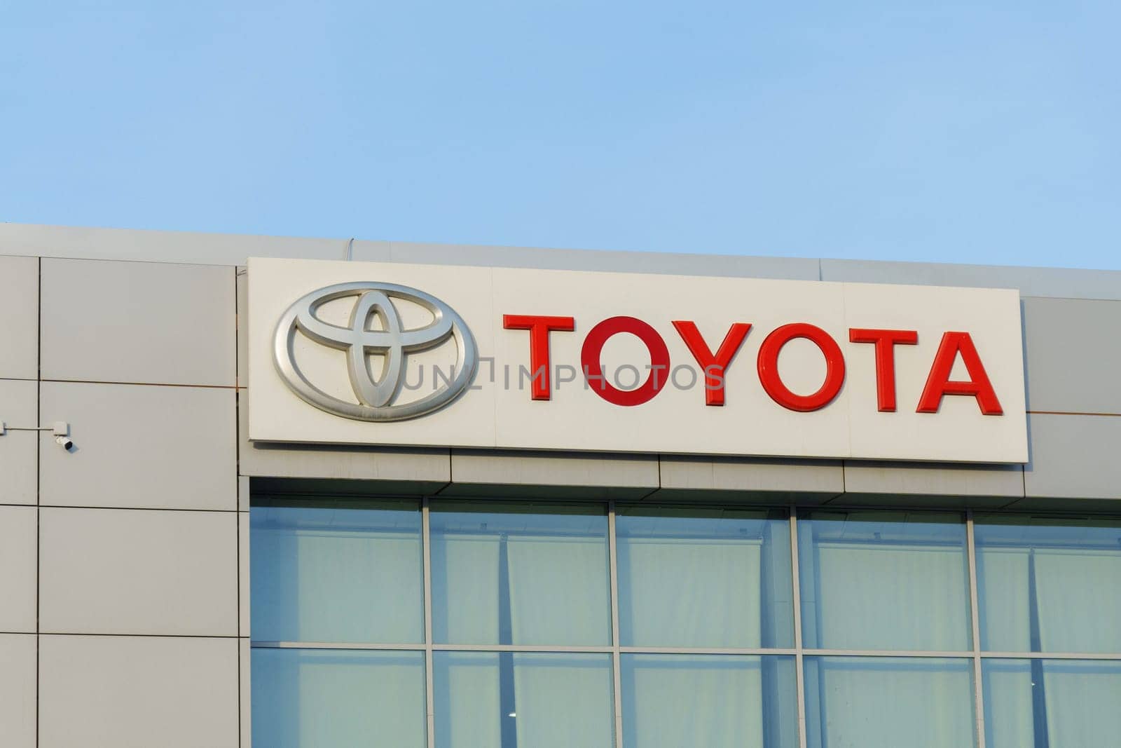 Tyumen, Russia-March 18, 2024: Toyota sign standing prominently against a clear blue sky, showcasing the iconic brand logo