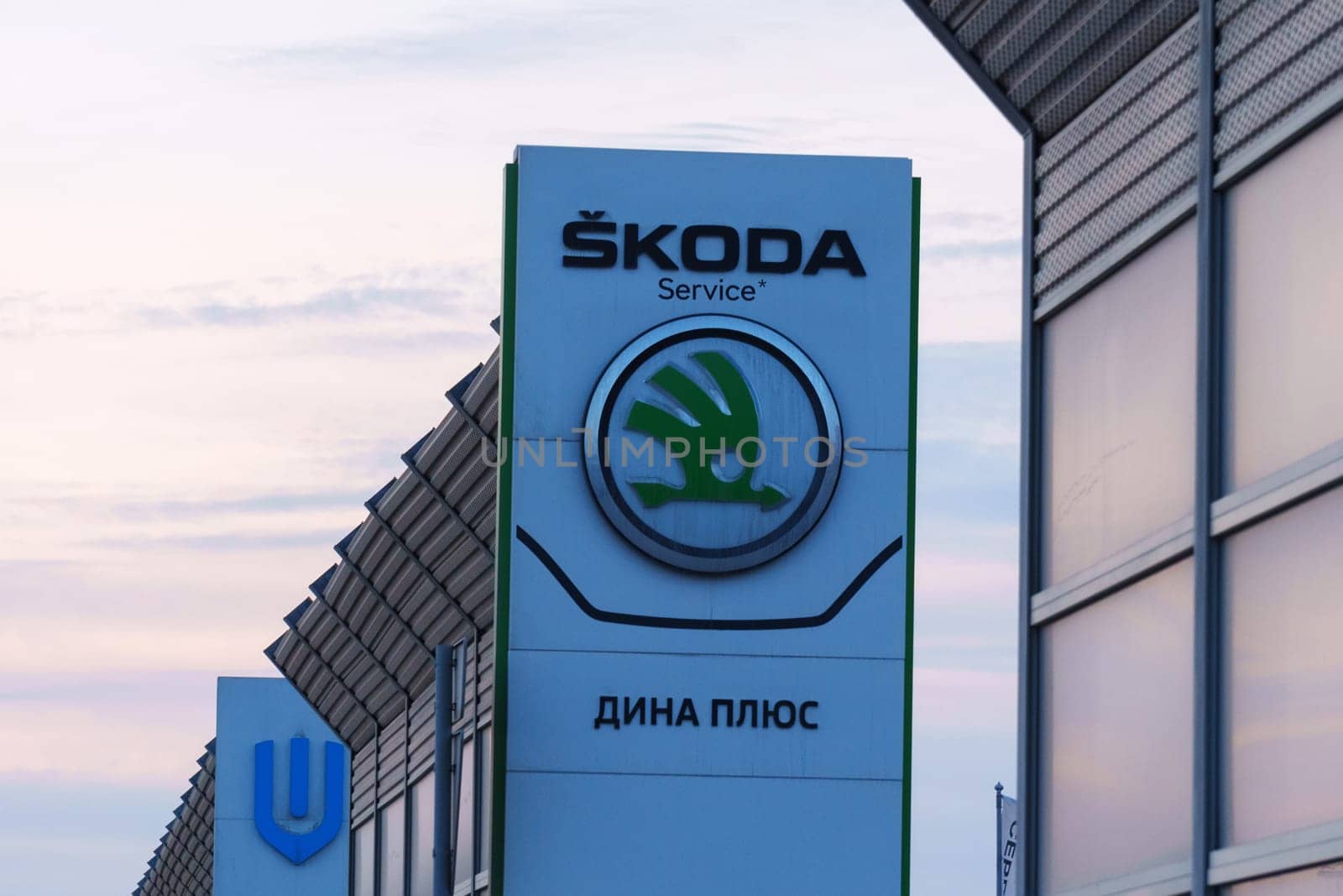 Tyumen, Russia-March 18, 2024: Skoda logo car advertisement on its side, showcasing the brands logo and vehicle model.