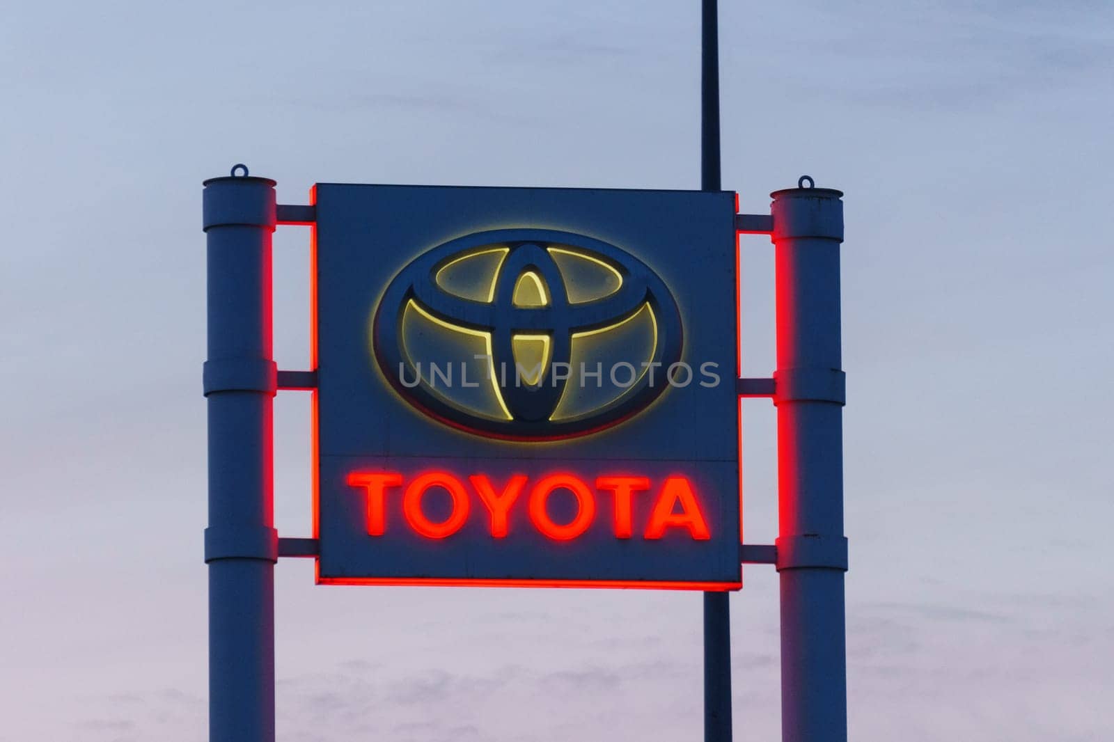 Tyumen, Russia-March 18, 2024: Toyota sign standing prominently against a clear blue sky, showcasing the iconic brand logo
