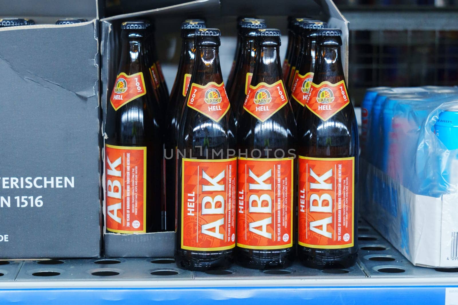 Tyumen, Russia-March 02, 2024: ABK lager beer bottles close up supermarket shelf. Selective focus