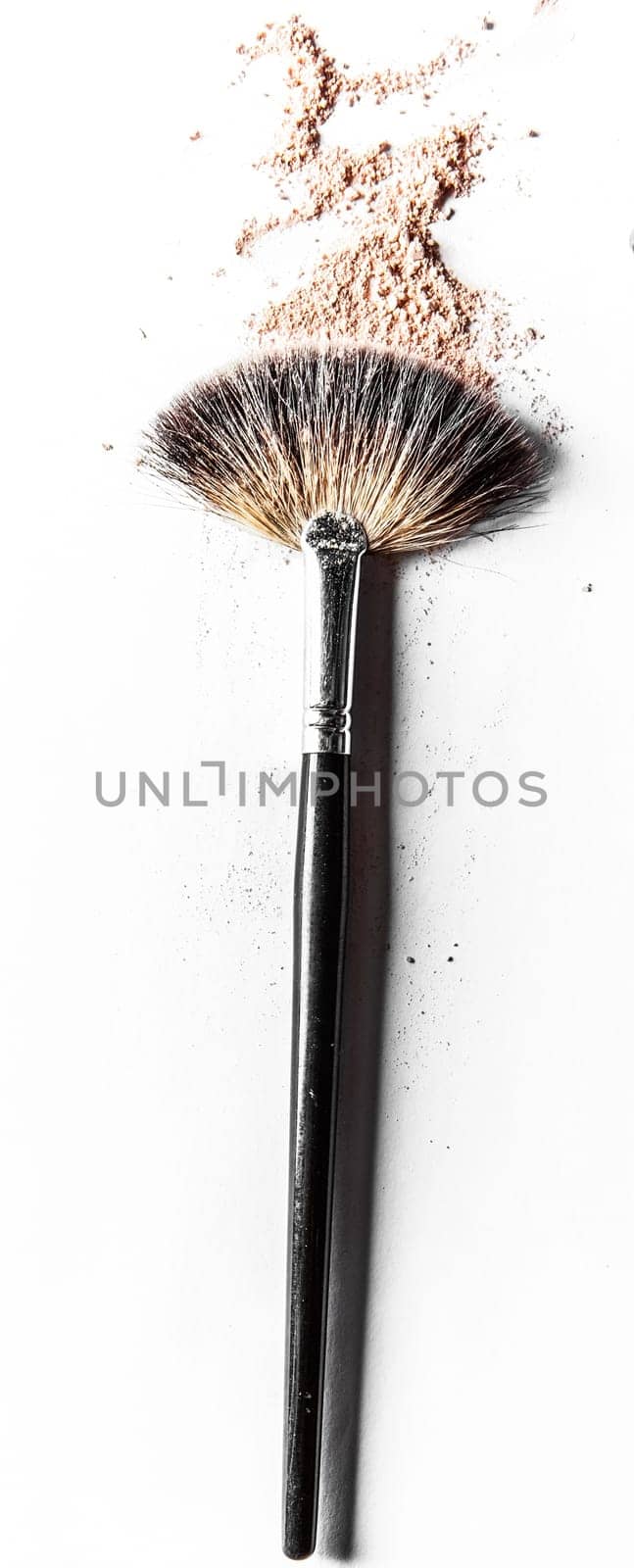 Beauty texture, cosmetic product and art of make-up concept - Brush and beige powder close-up isolated on white background