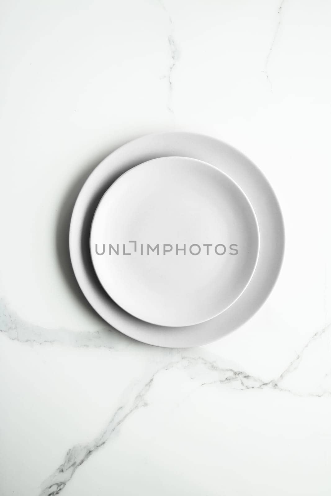 White empty plate on marble, flatlay - stylish tableware, romantic table decor and food menu concept. Serve the perfect dish