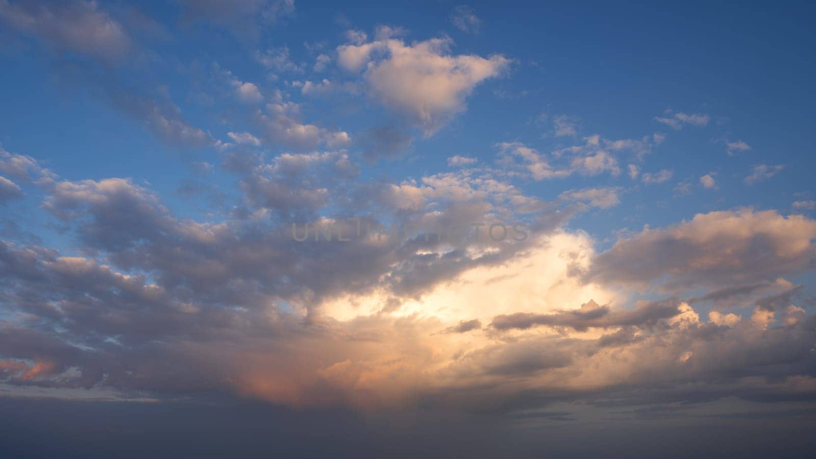 Low angle view to evening sky with dramatic clouds