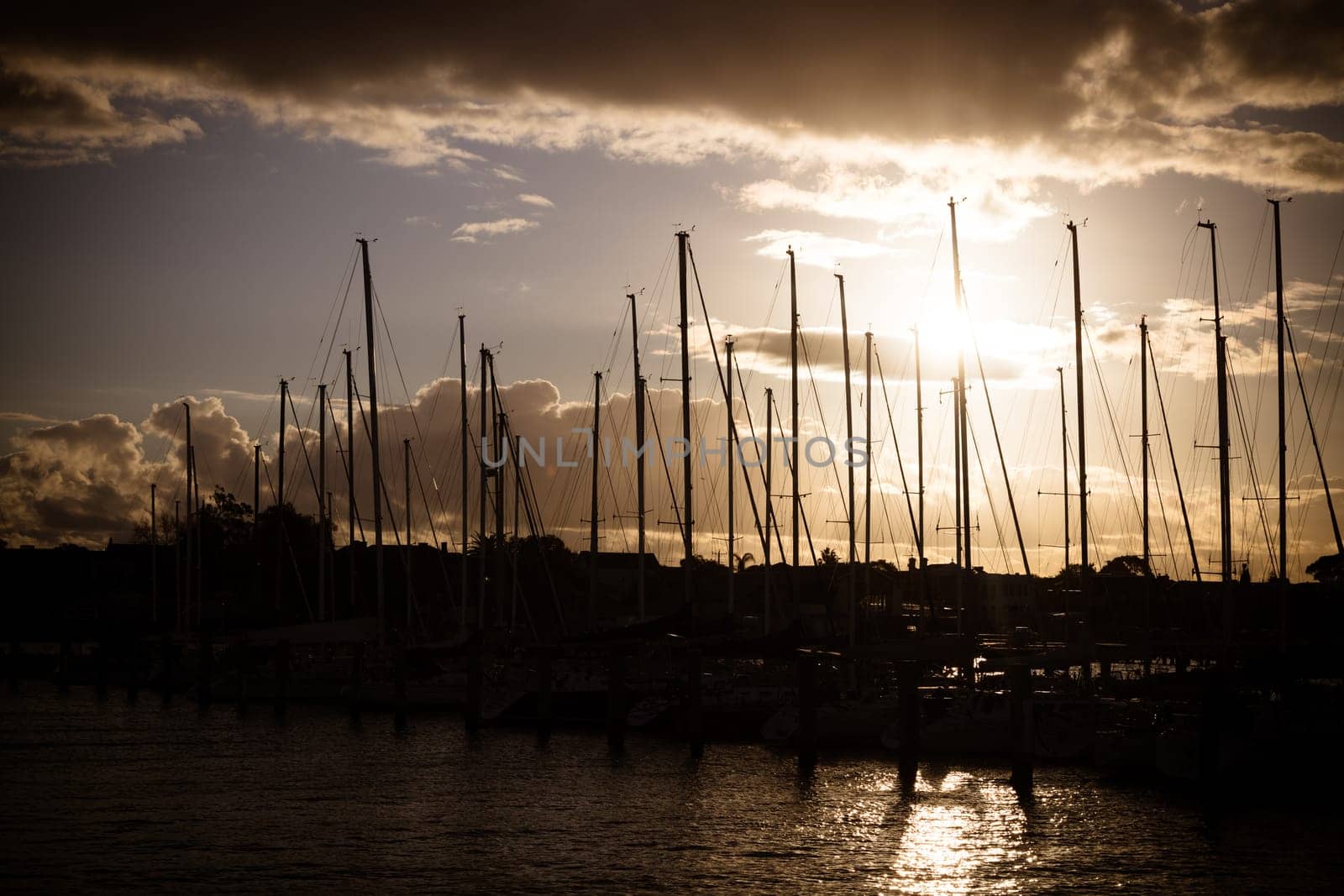 Hobsons Bay around Ferguson St Pier in Williamstown waterfront at dusk in winter in Victoria, Australia