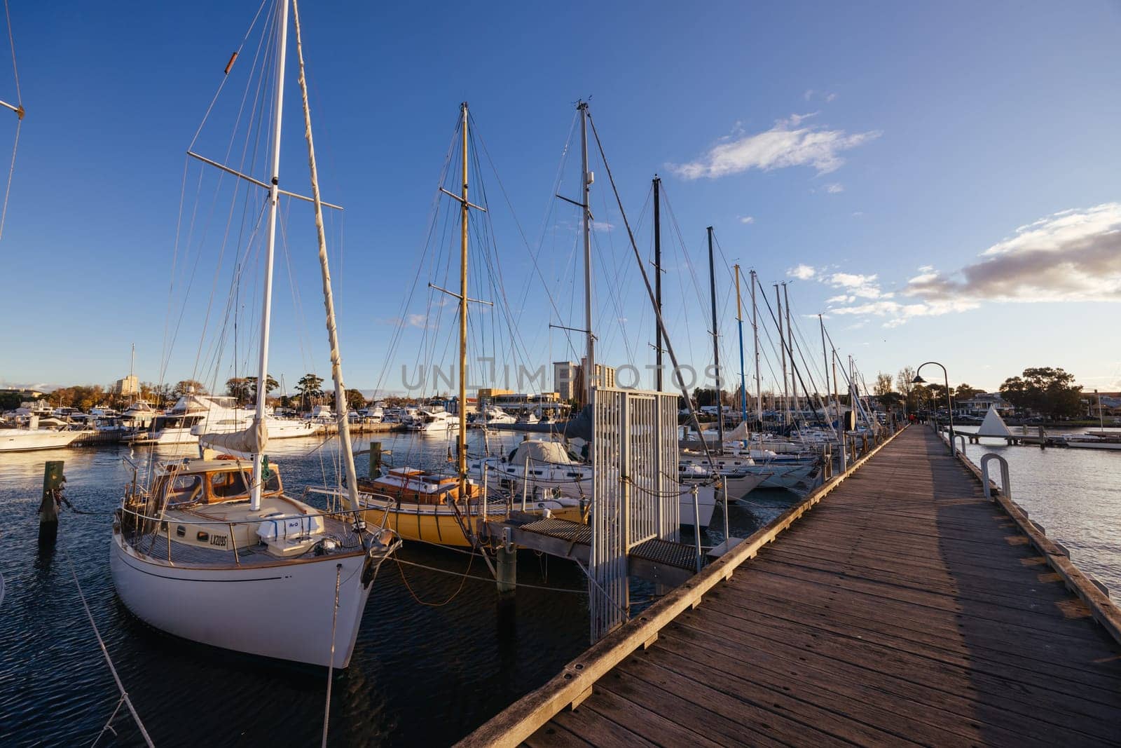 Hobsons Bay around Ferguson St Pier in Williamstown waterfront at dusk in winter in Victoria, Australia