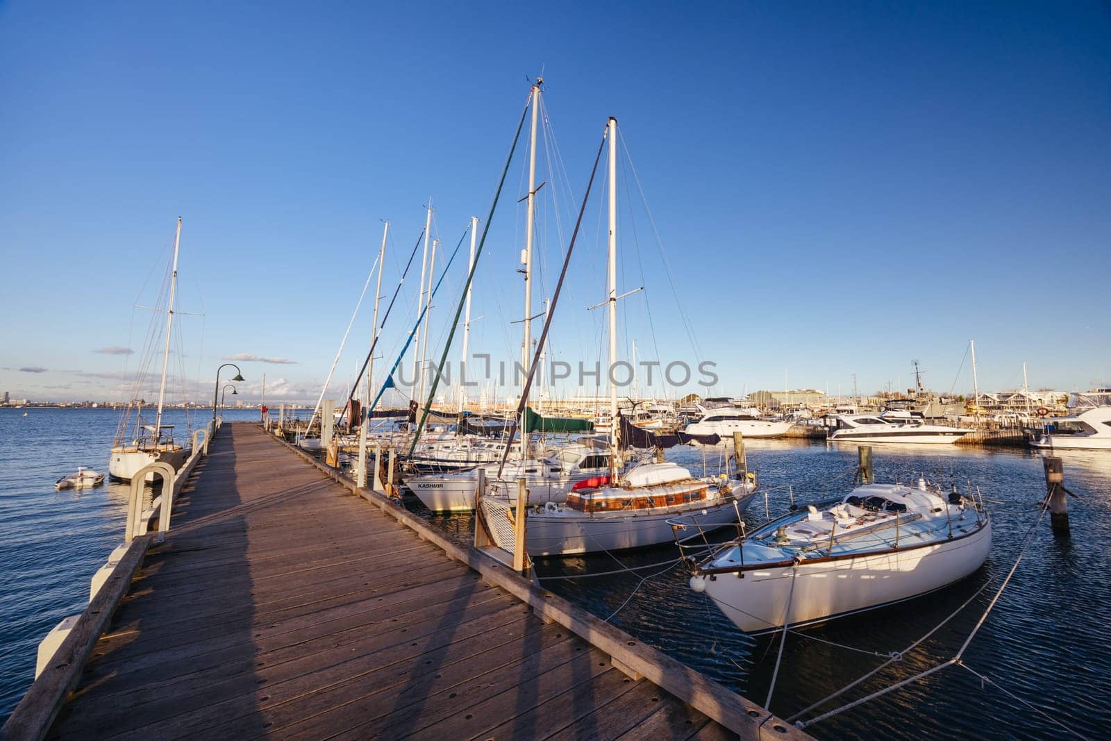 Hobsons Bay around Ferguson St Pier in Williamstown waterfront at dusk in winter in Victoria, Australia