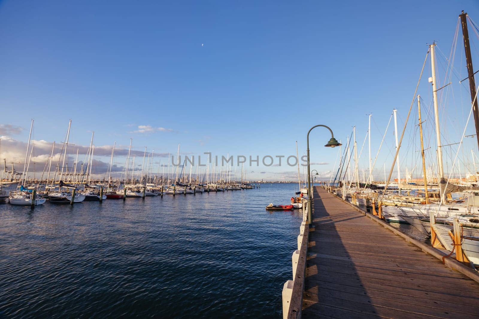 Hobsons Bay around Ferguson St Pier in Williamstown waterfront at dusk in winter in Victoria, Australia