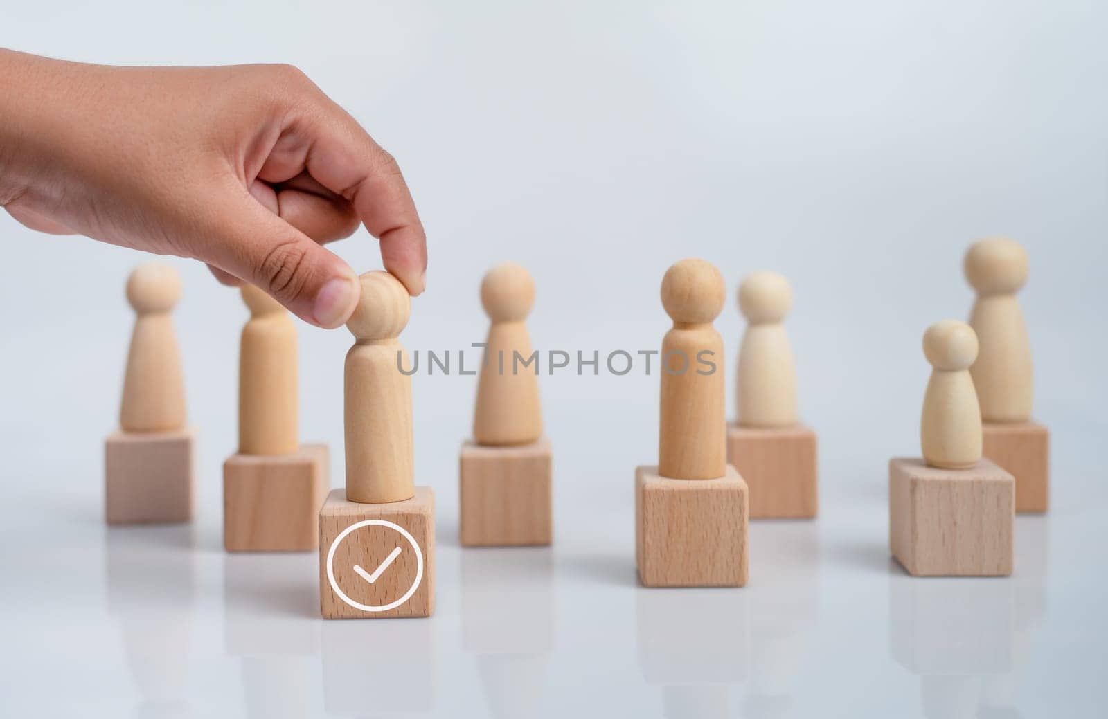 concept Business and HR for leadership and team leader, one wooden dolls stand out in front  Different and stand out from the group