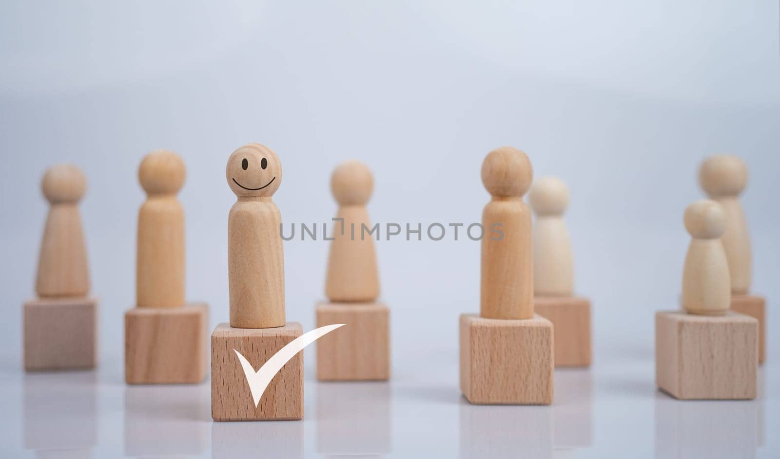 Concept Business and HR for leadership and team leader, one wooden dolls different and stand out from the group. by Unimages2527