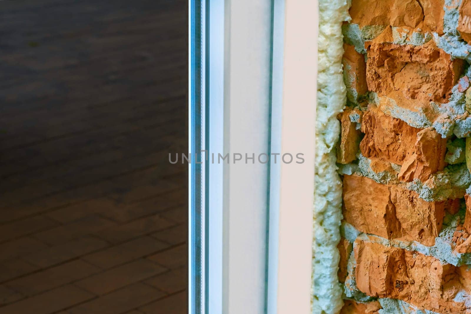 an opening in the wall or roof of a building that is fitted with glass