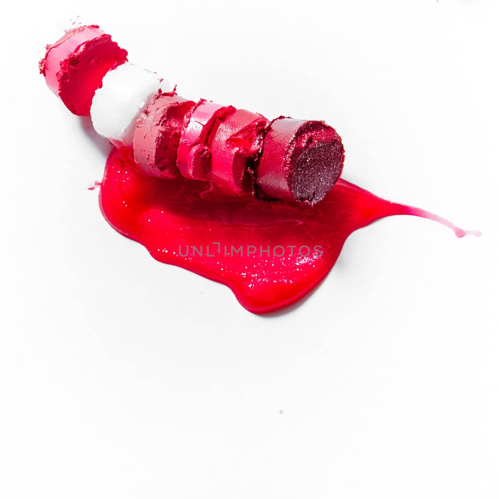 Beauty texture, cosmetic product and art of make-up concept - Cutted and liquid lipstick close-up isolated on white background