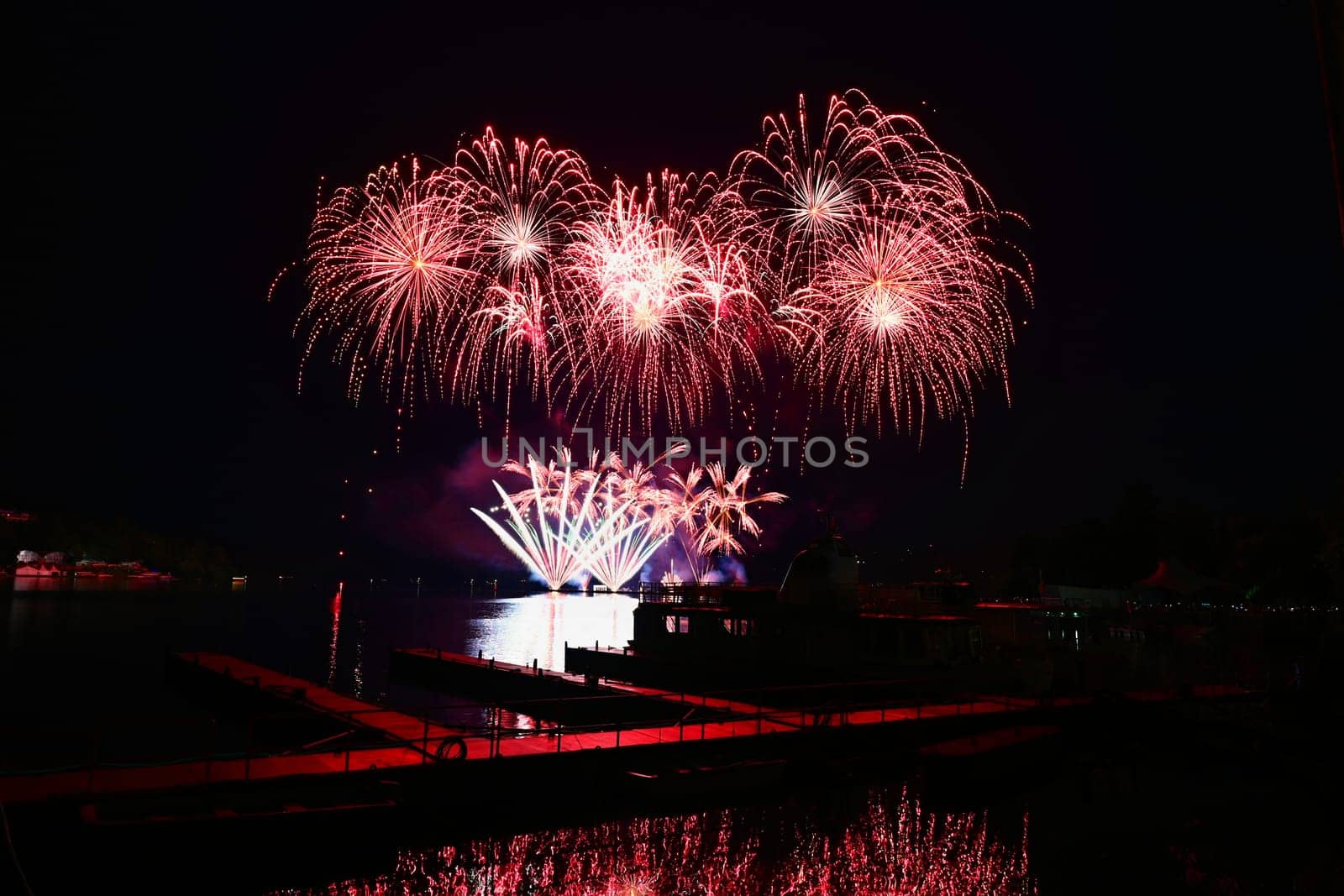 Beautiful colorful fireworks with reflections in water. Brno dam, the city of Brno-Europe. International Fireworks Competition. by Montypeter