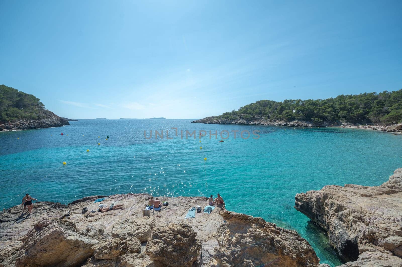 Turquoise waters of Cala Saladeta in Ibiza in summer.