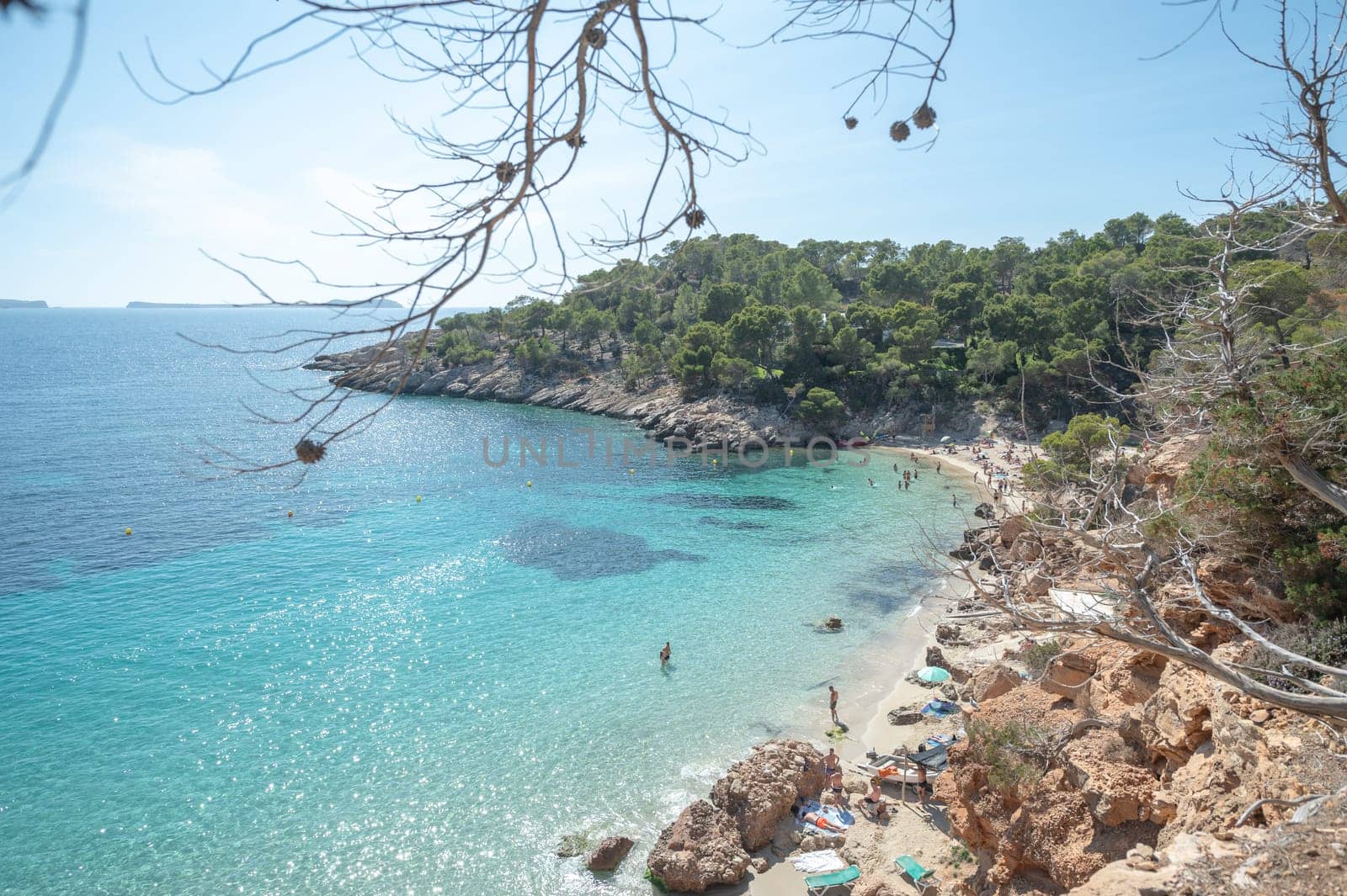 Turquoise waters of Cala Saladeta in Ibiza in summer.