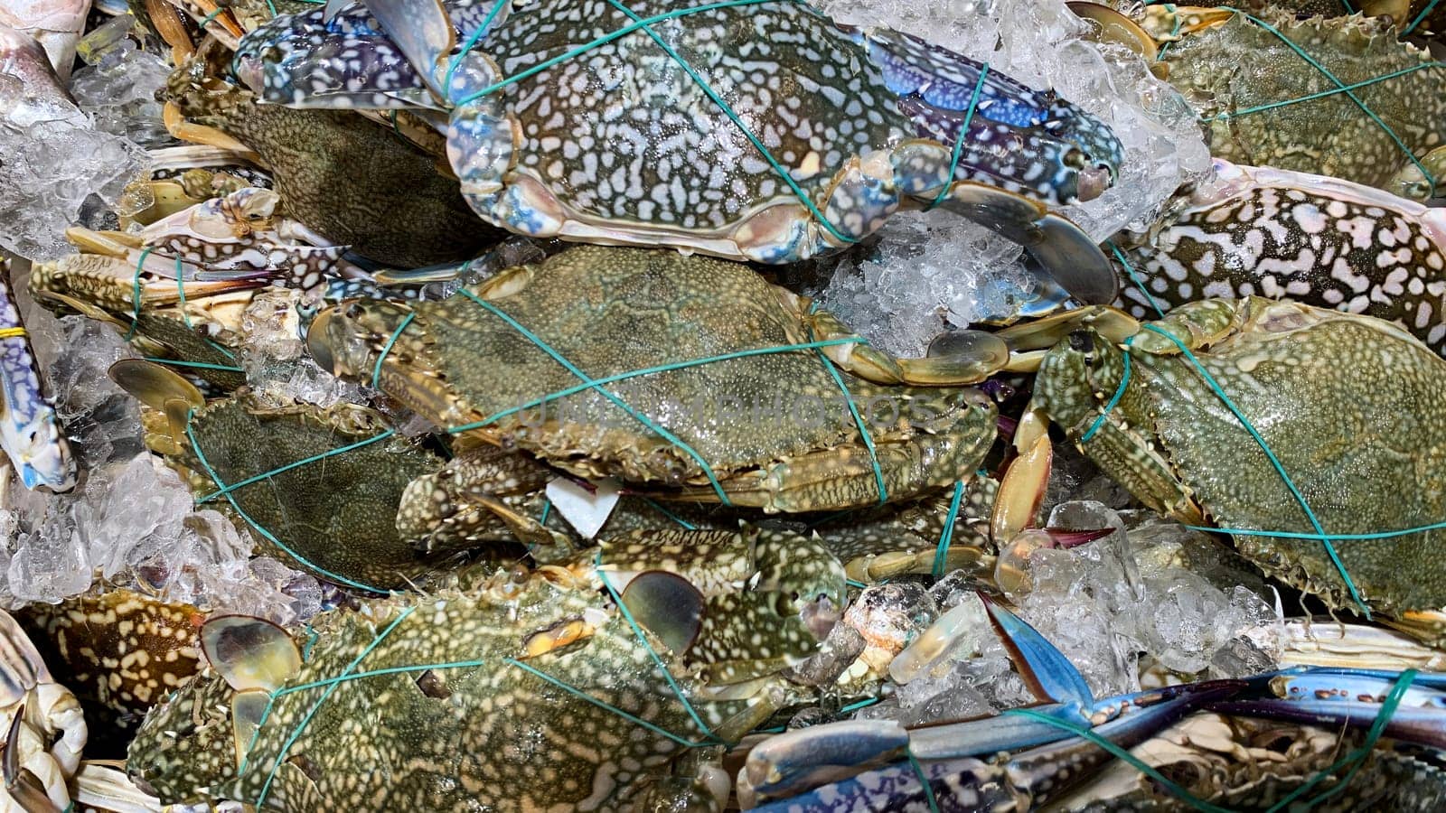 Top view of fresh crabs display in market. Seafood concept.