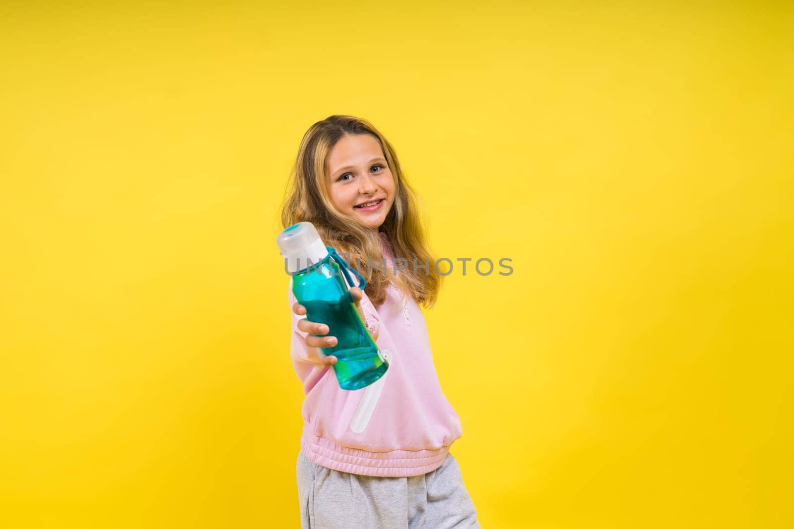 Girl teen hold water bottle. Health and a water balance. Drink and beverage concept.