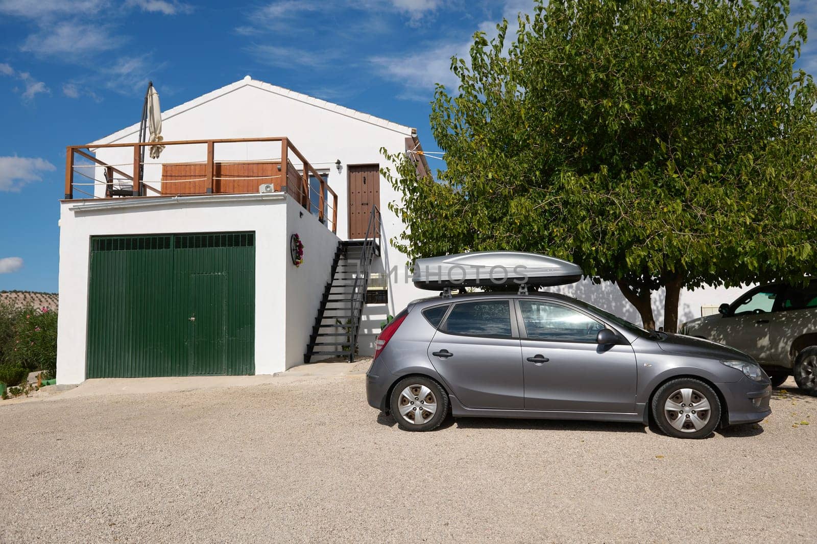 Modern house with car in front and green garage door by artgf