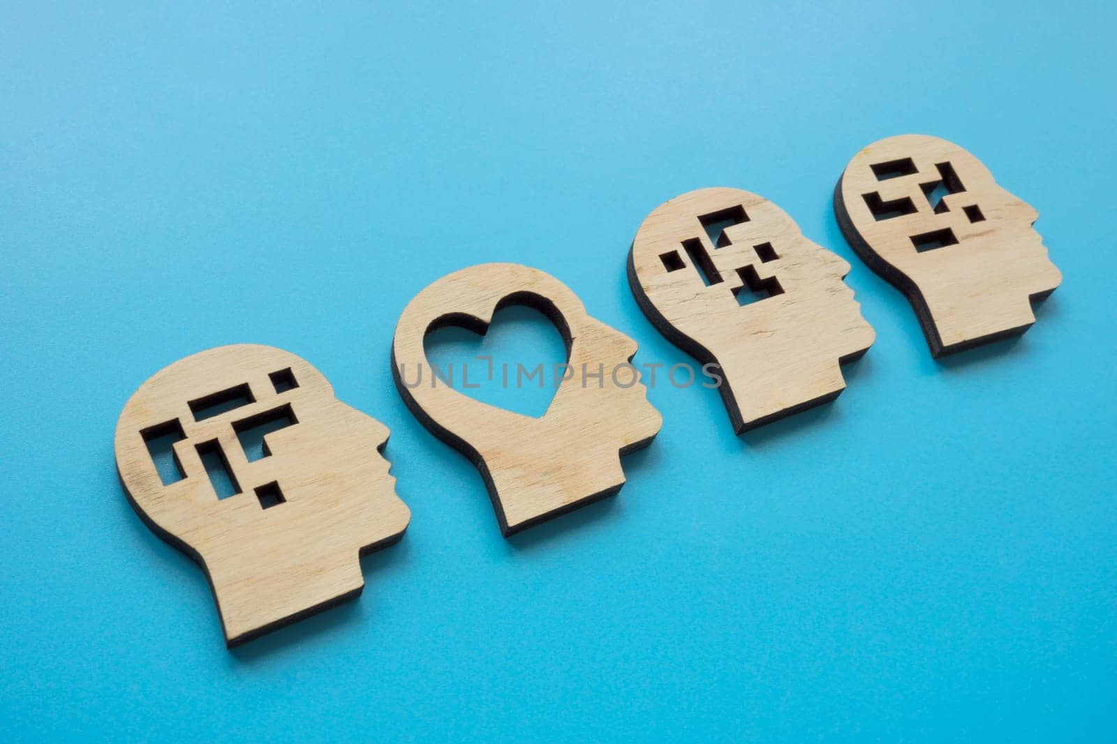 Heads with heart and logical structures. Emotional intelligence concept.