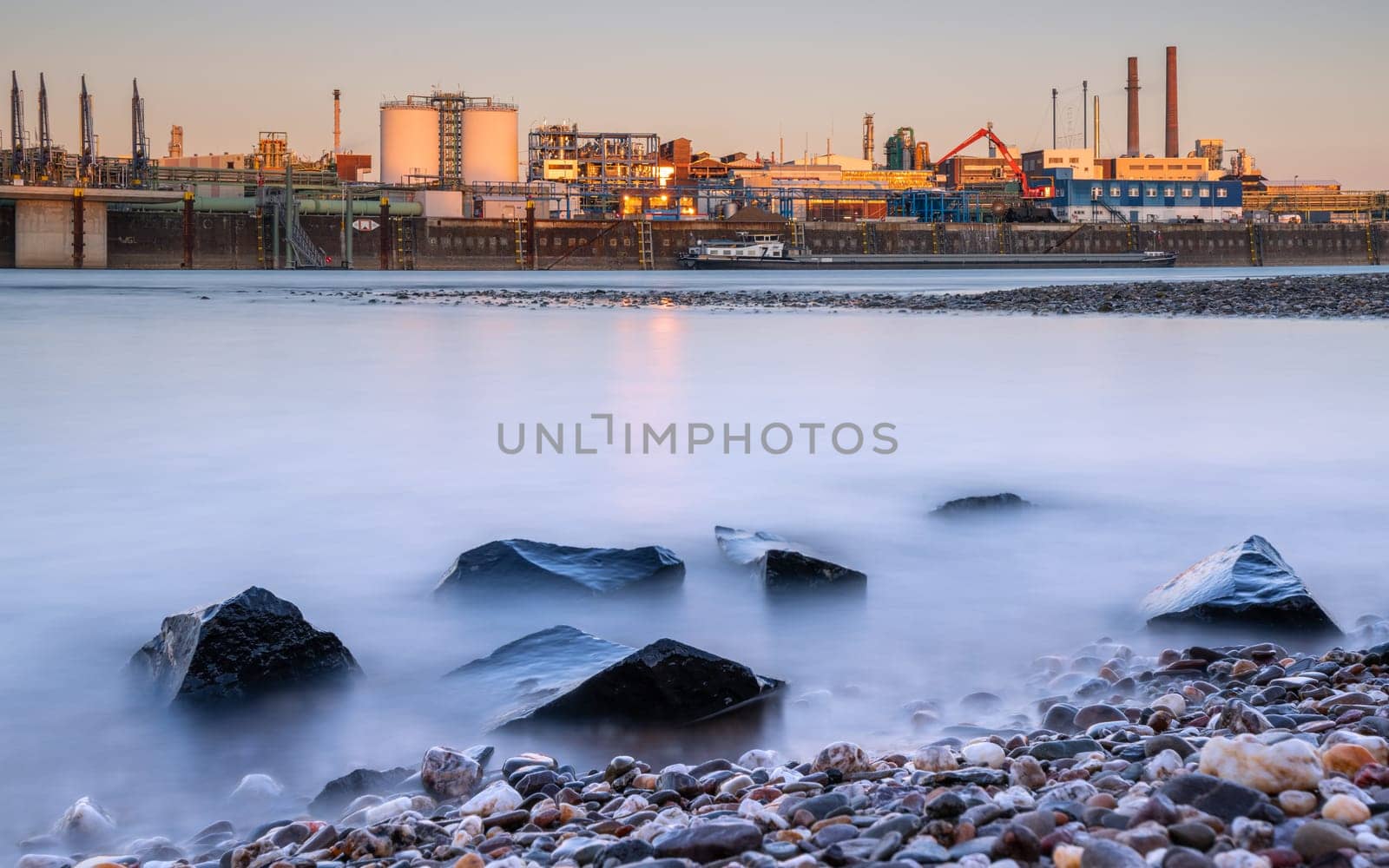 LEVERKUSEN, GERMANY - MARCH 1, 2023: Industrial area of Chempark Leverkusen close to Rhine River during Sunset on March 1, 2023 in North Rhine Westphalia, Germany