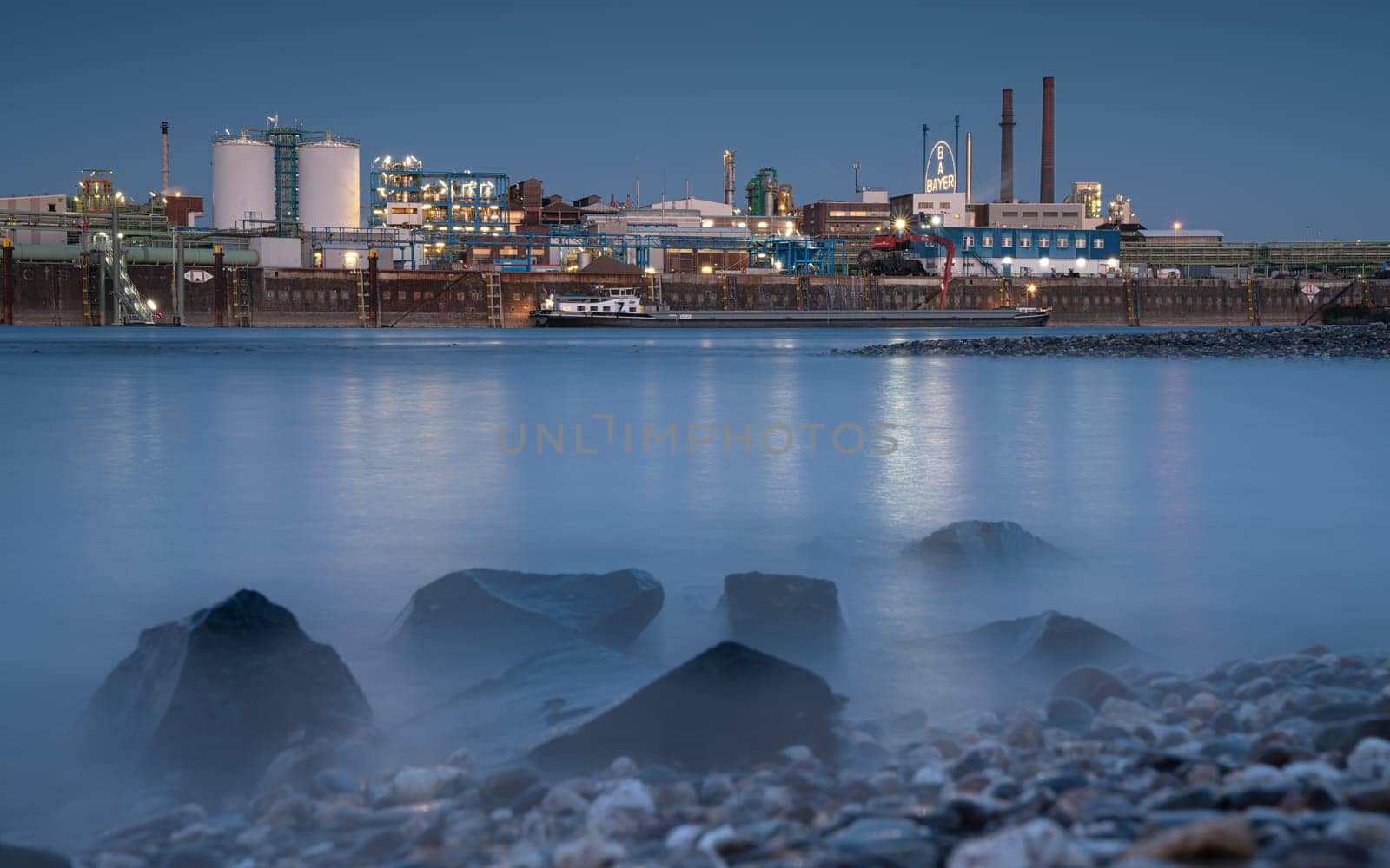 LEVERKUSEN, GERMANY - MARCH 1, 2023: Industrial area of Chempark Leverkusen close to Rhine River during Sunset on March 1, 2023 in North Rhine Westphalia, Germany