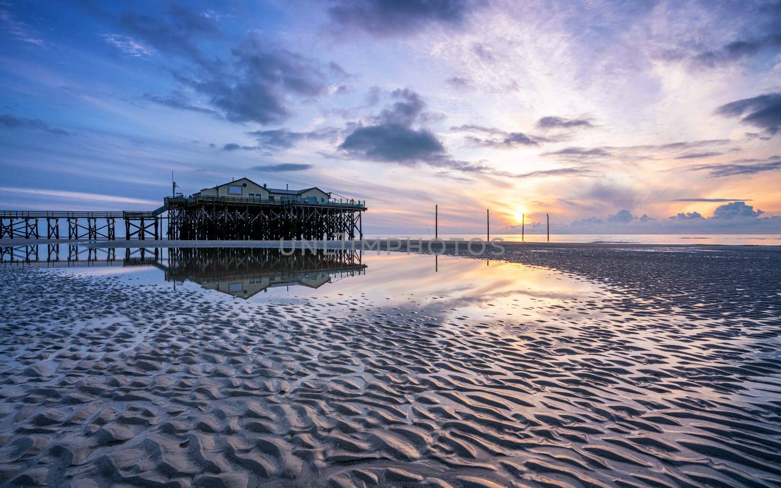 SANKT PETER ORDING, GERMANY - MARCH 8, 2023: Panoramic image of beach houses of Sankt Peter Ording close to the North Sea on March 8, 2023 in North Frisia, Germany