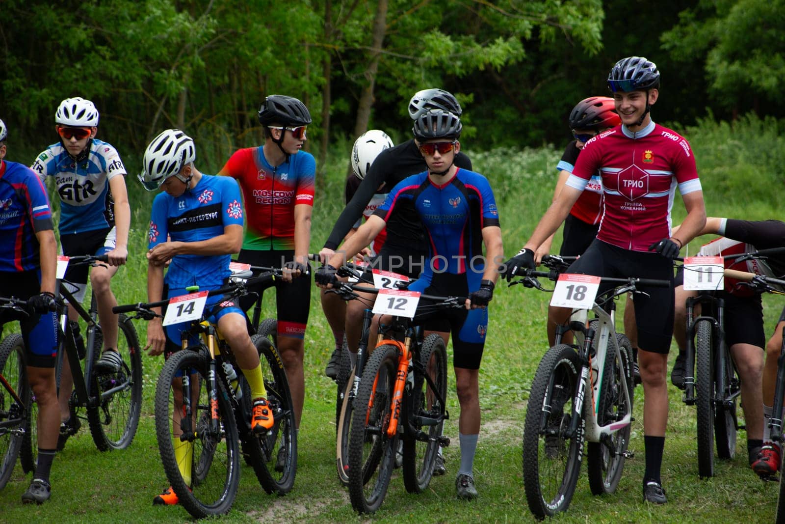 Kursk, Russia, June 15, 2024: Group of young cyclists preparing before the start of mountain biking competition