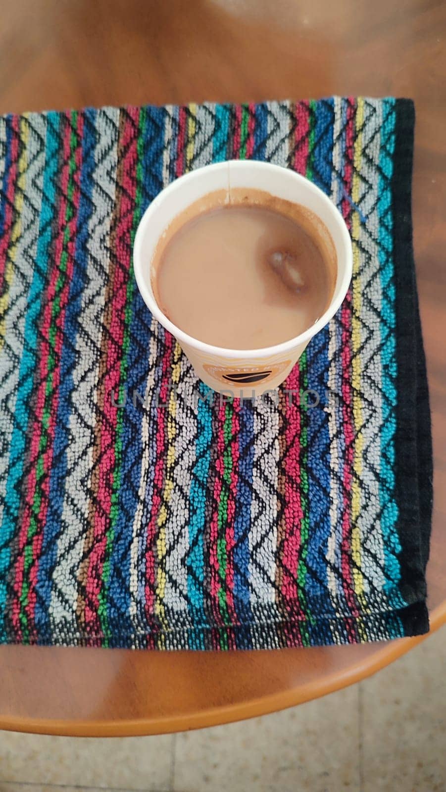 paper coffee glass, kitchen towel, coffee table. High quality photo