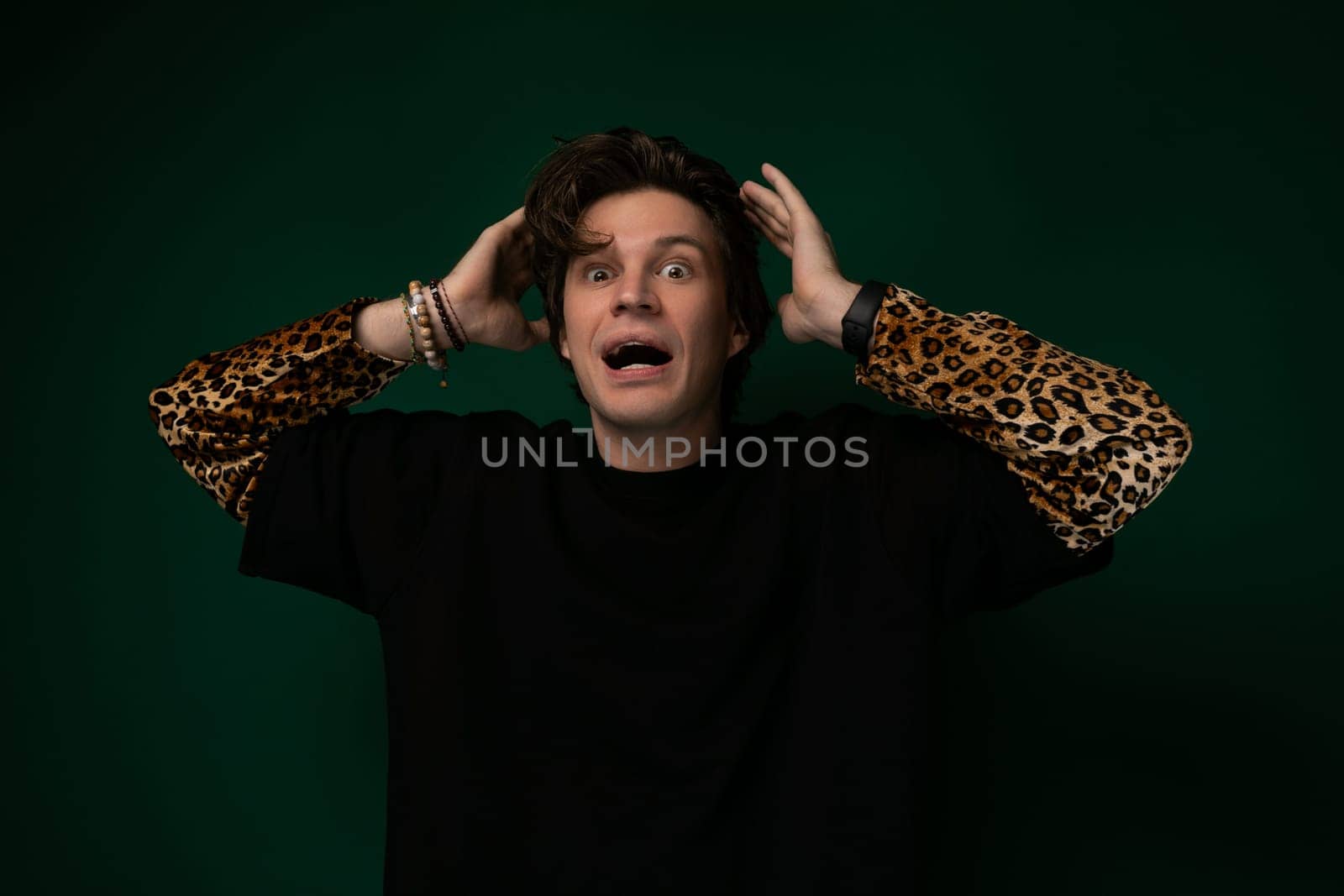 A middle-aged man with a surprised expression on his face, eyes widened and mouth slightly agape. He appears caught off guard or shocked by something unexpected.