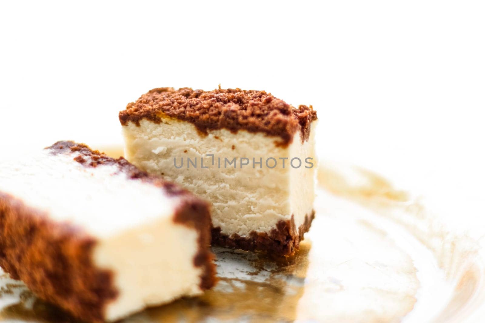Sweet food, restaurant and luxury gourmet gastronomy concept - Classic cheesecake with chocolate on a golden plate, european cuisine dessert