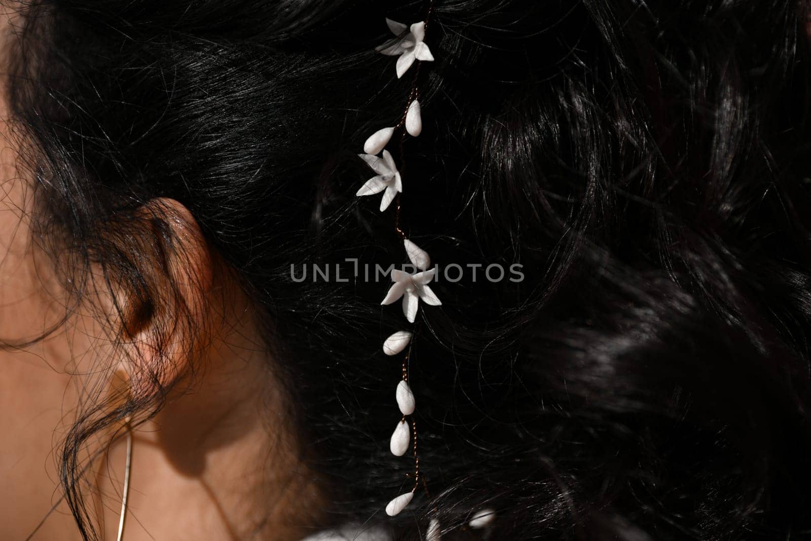 Brunette bride with a white lilies in her hair Hairstyle