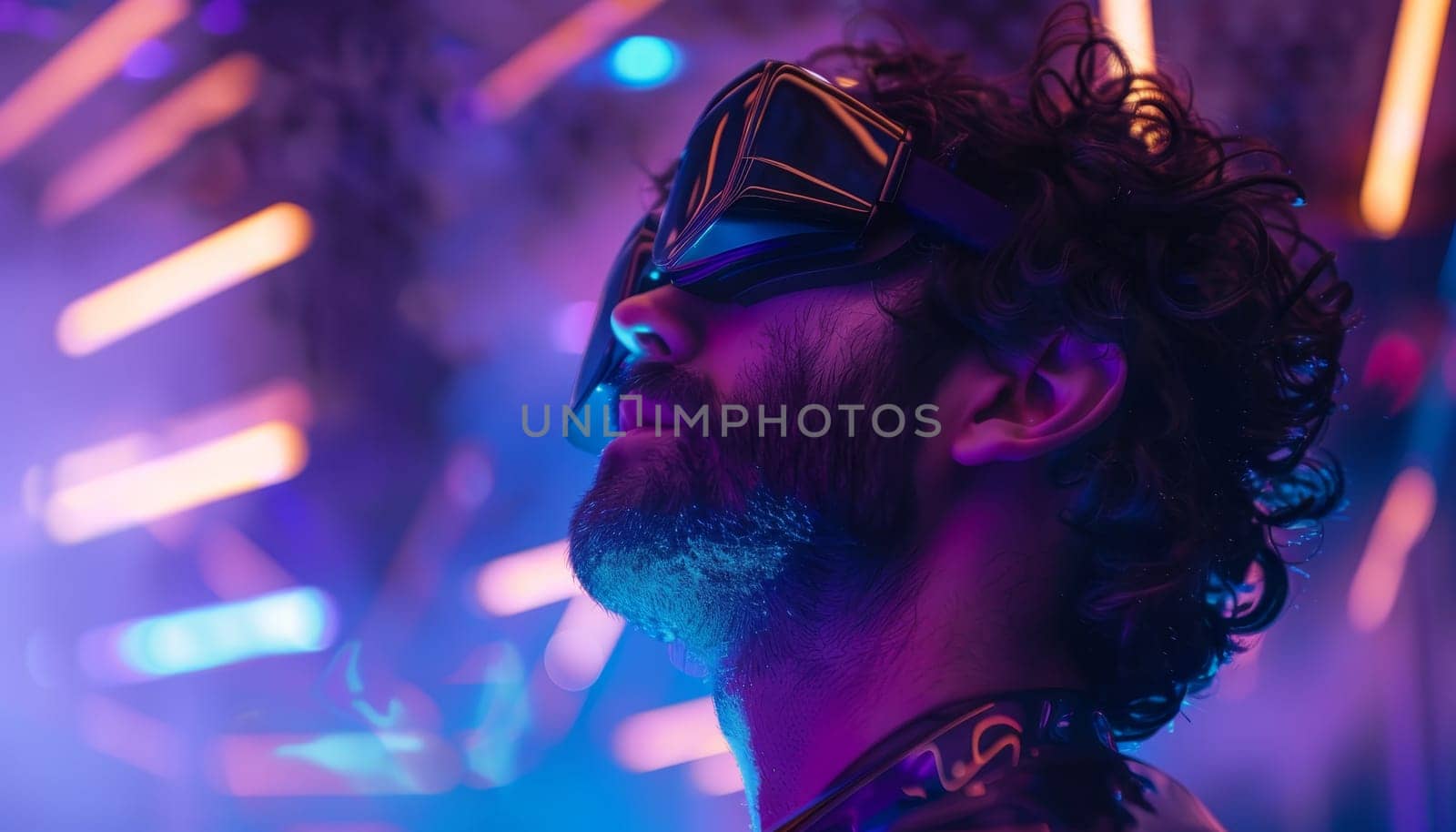 A man wearing glasses and a beard stands in front of a neon sign. The image has a futuristic and vibrant feel to it, with the neon sign adding to the overall atmosphere. The man's facial expression