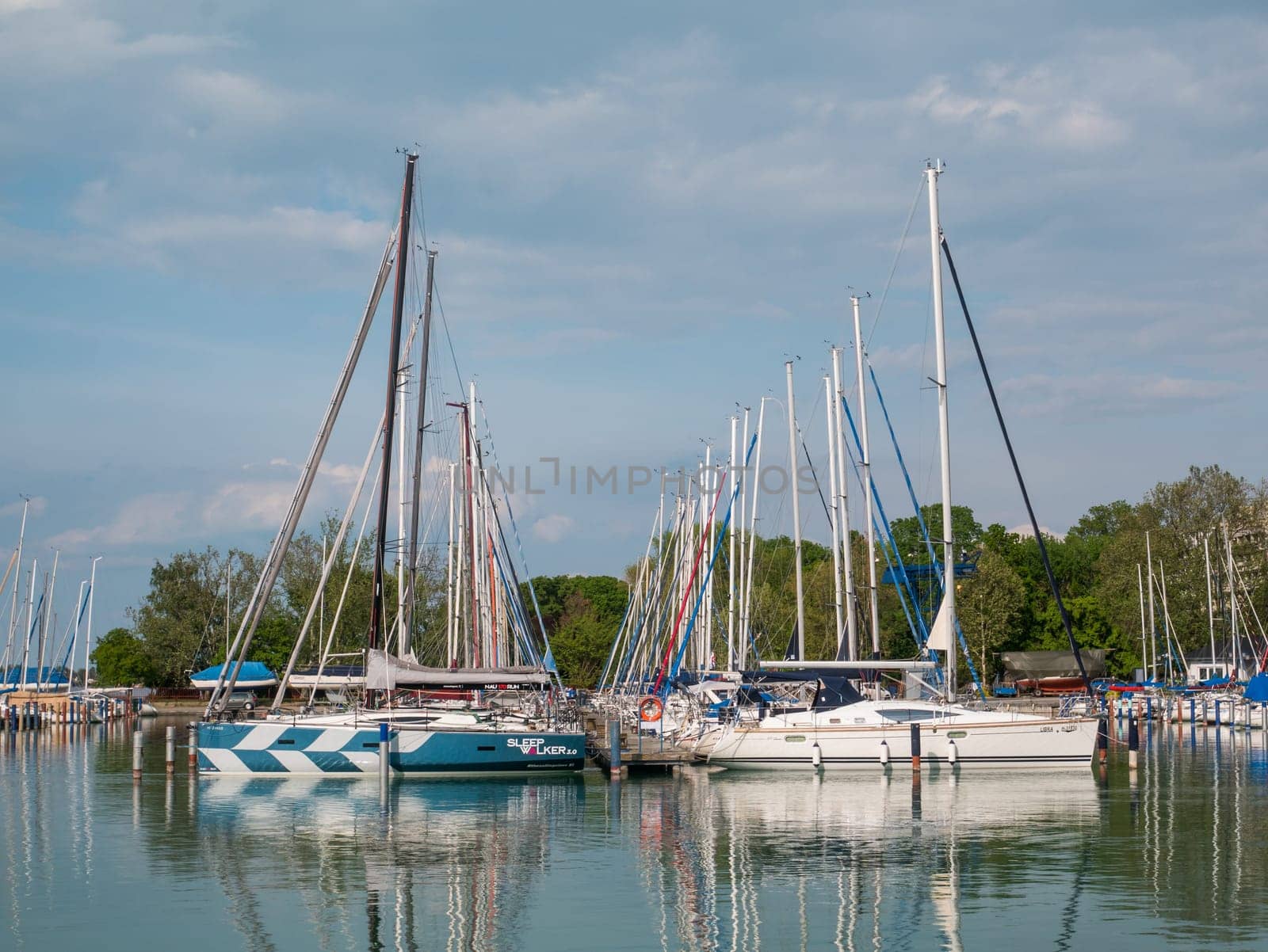 Boats and sailboats in marine at lake Balaton by zebra