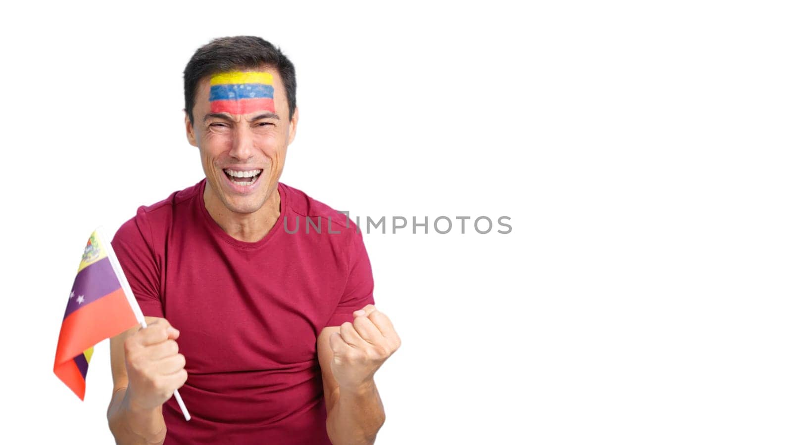 Man passionately cheering for Venezuela screaming and waving a national flag