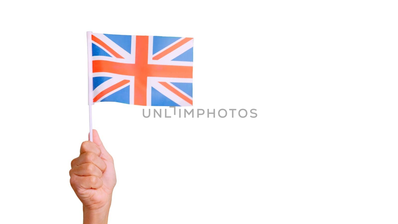 Photo of wind waving a british pennant holding by a hand. Slow Motion video