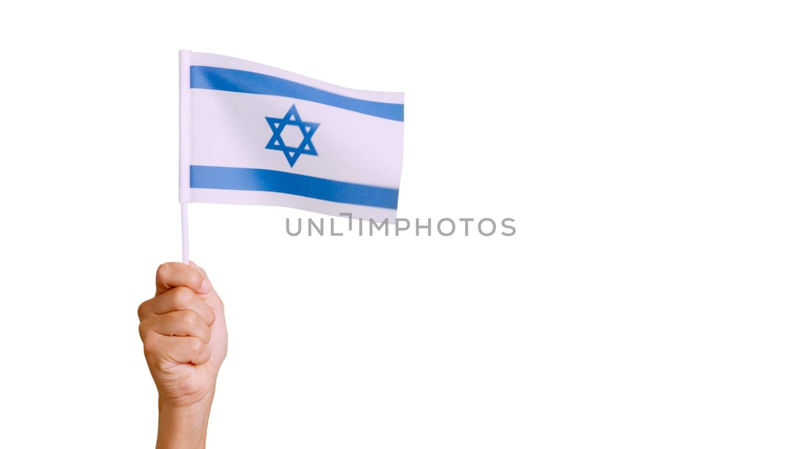 Photo of wind waving a israeli pennant holding by a hand. Slow Motion video