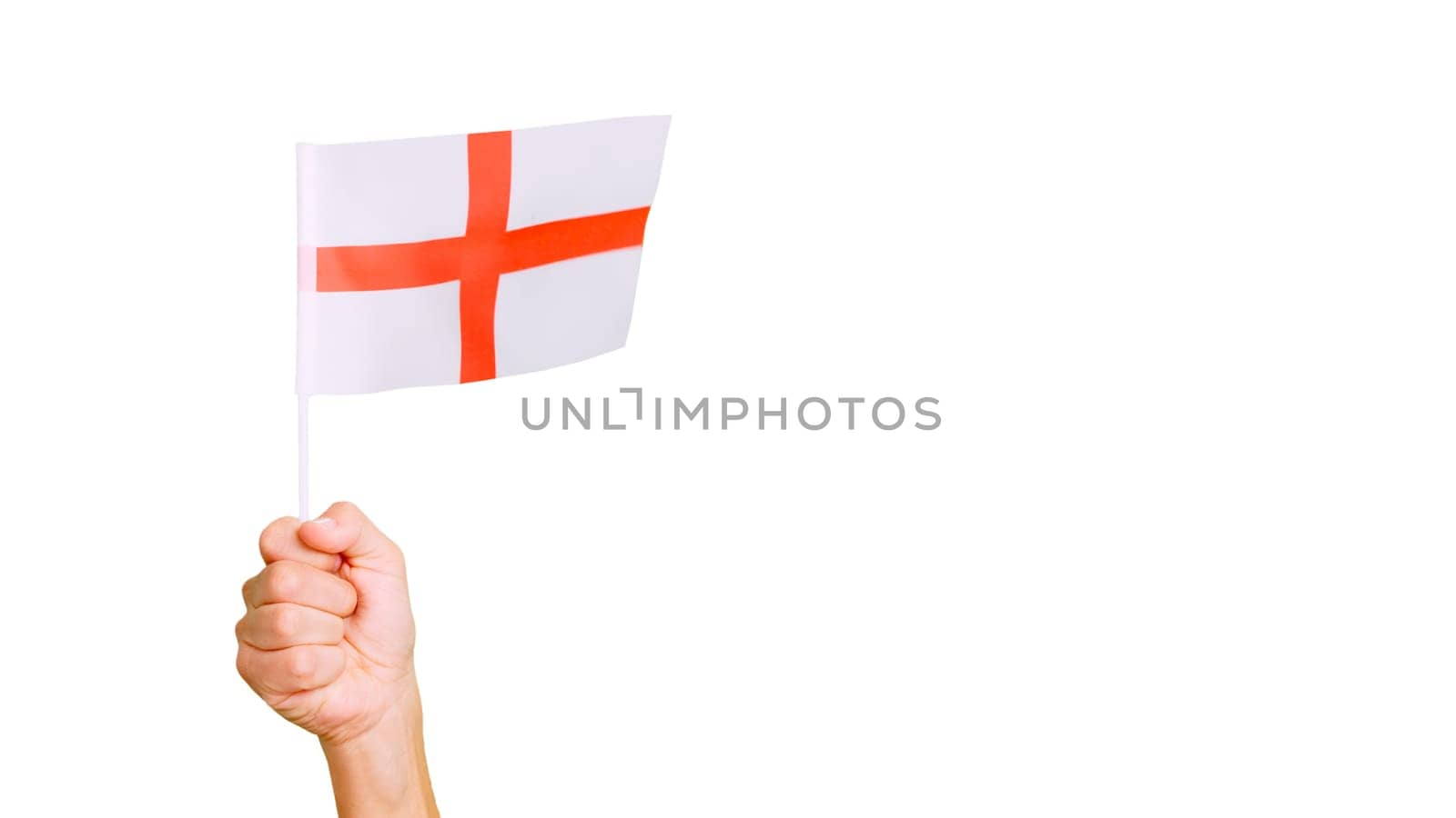 Photo of wind waving a english pennant holding by a hand