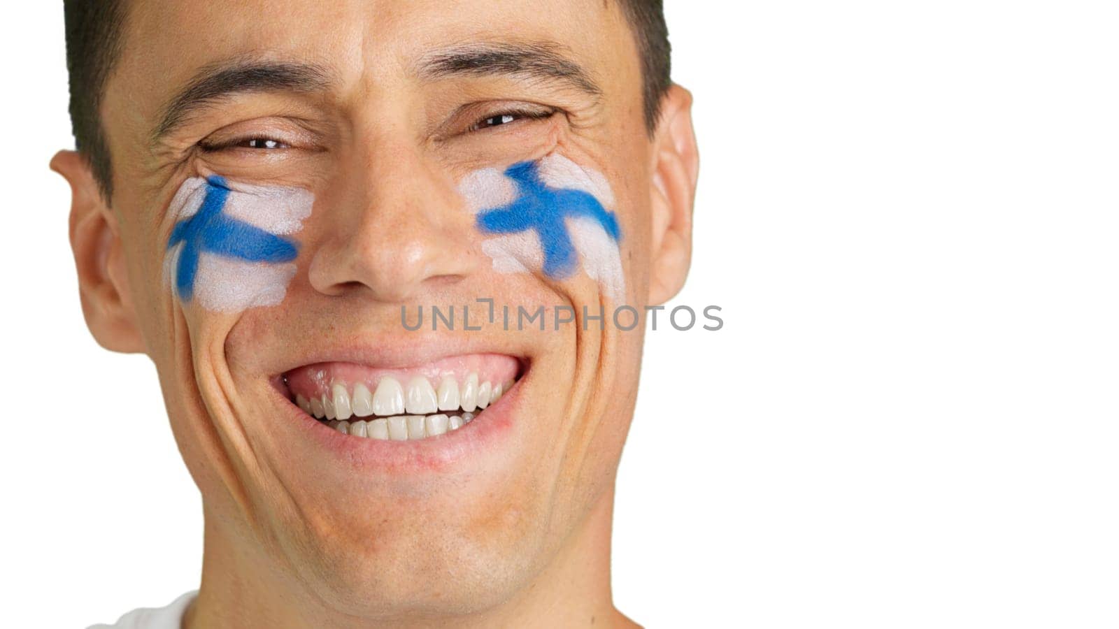 Man with a finnish flag painted on the face smiling by ivanmoreno