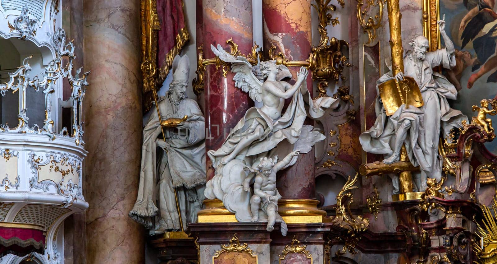 OTTOBEUREN, BAVARIA, GERMANY, JUNE 04, 2022 : Rococo stuccowork statues, by various anonymous artists, 18th century,  in  Ottobeuren abbey basilica