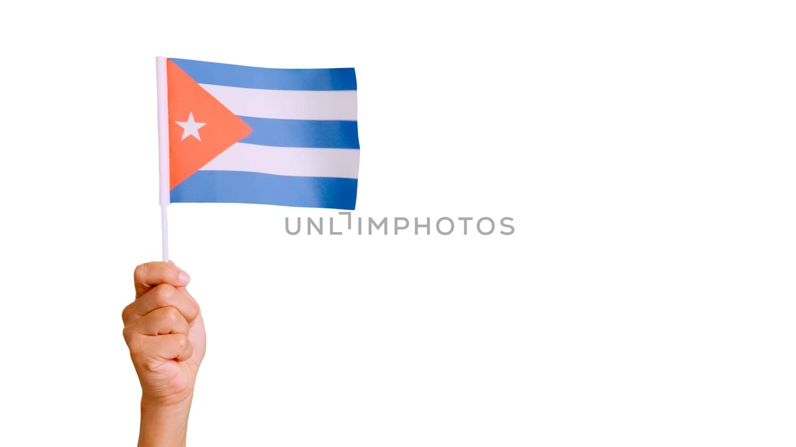 Photo of wind waving a cuban pennant holding by a hand. Slow Motion video