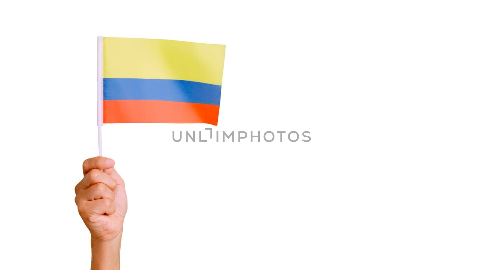 Photo of wind waving a colombian pennant holding by a hand. Slow Motion video