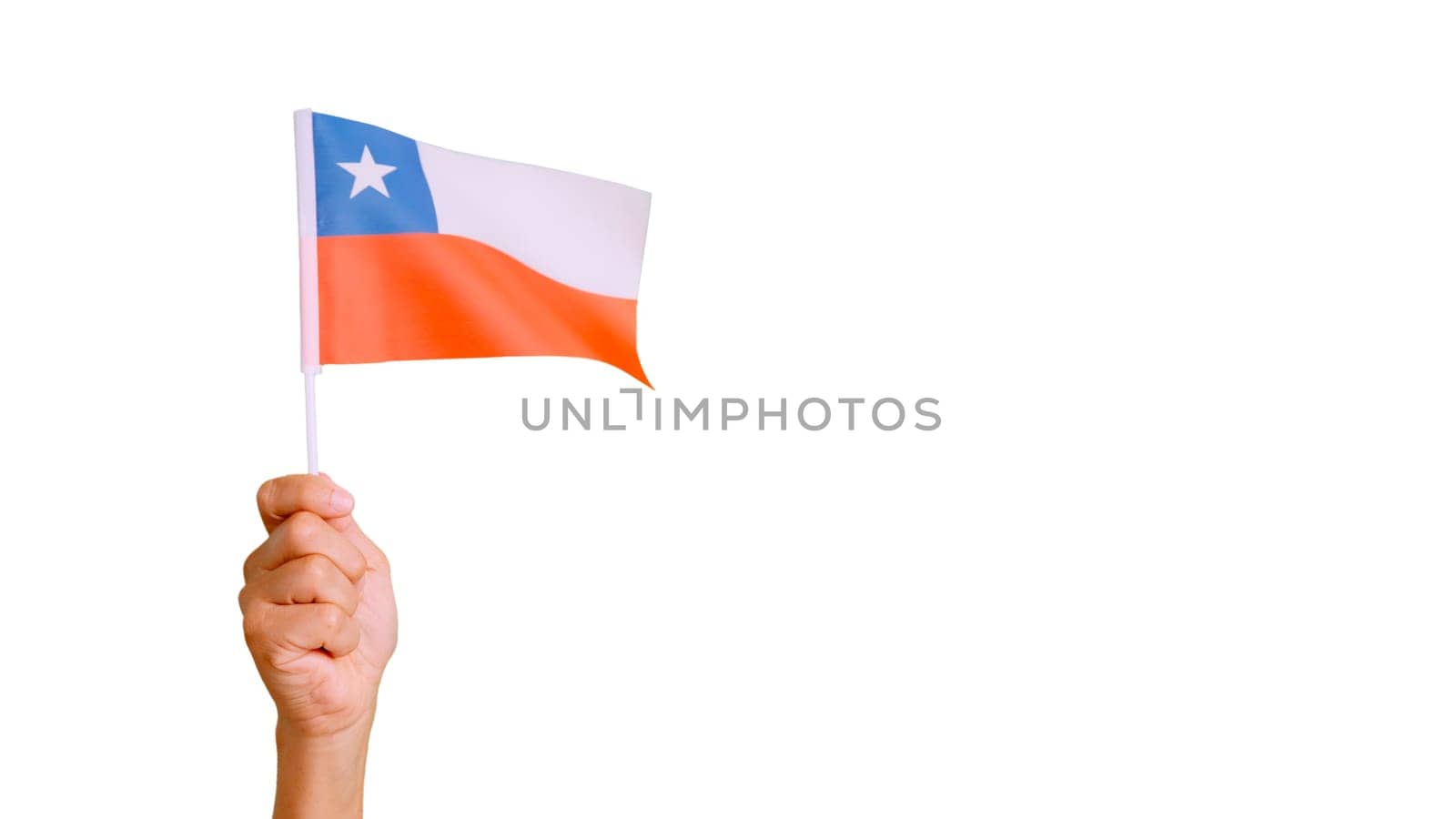 Photo of wind waving a chilean pennant holding by a hand. Slow Motion video