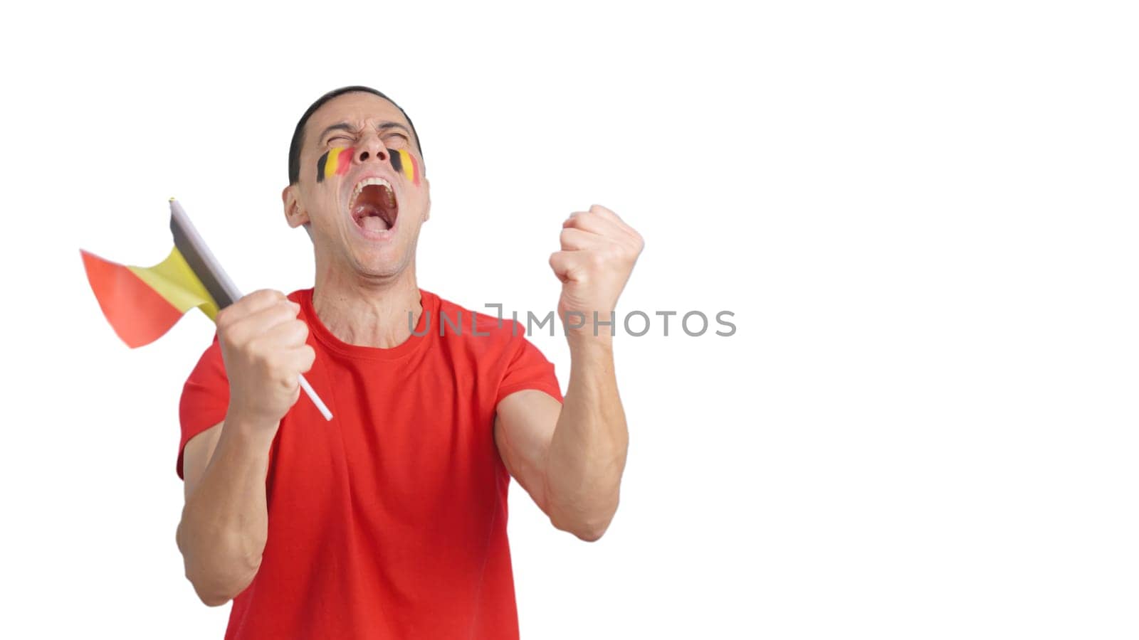 Man passionately cheering for Belgium screaming and waving a national flag